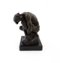 A 20thC cast bronze model of a crouching male nude. In the manner of Rodin. Approx. 8 1/4" high
