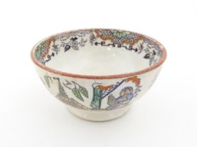 A Scottish bowl with Chinoiserie depicting figures in a landscape. Possibly Bell's Pottery.