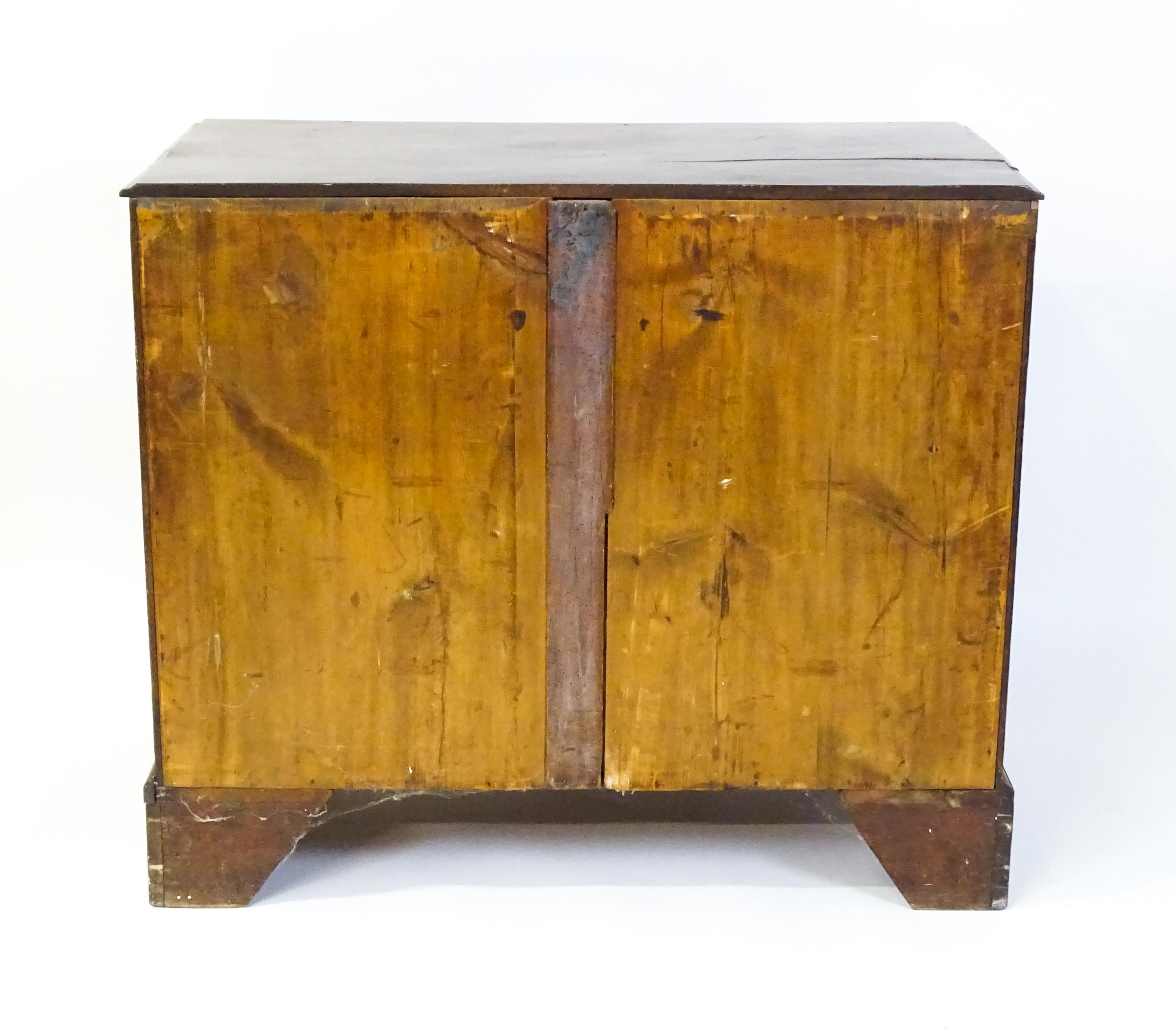 A late Georgian mahogany chest of drawers with a rectangular moulded top above three long drawers - Image 2 of 10