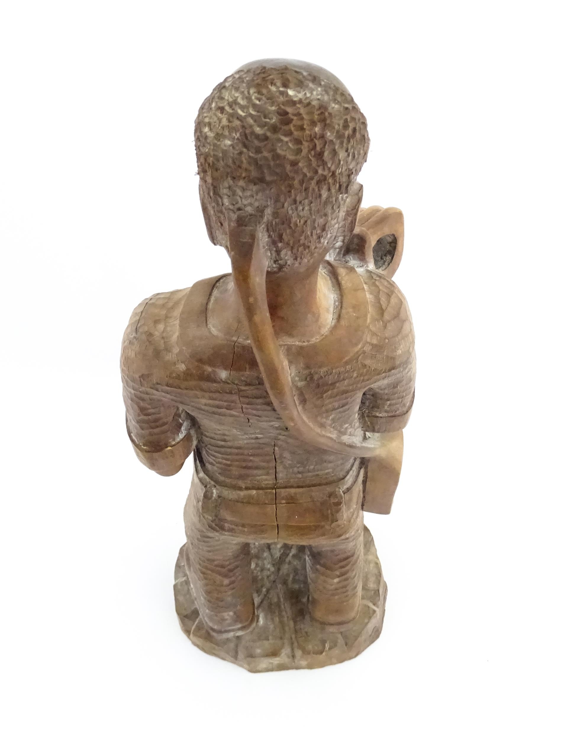 Ethnographic / Native / Tribal: An African carved wood figure modelled as a male farmer with a - Image 7 of 8