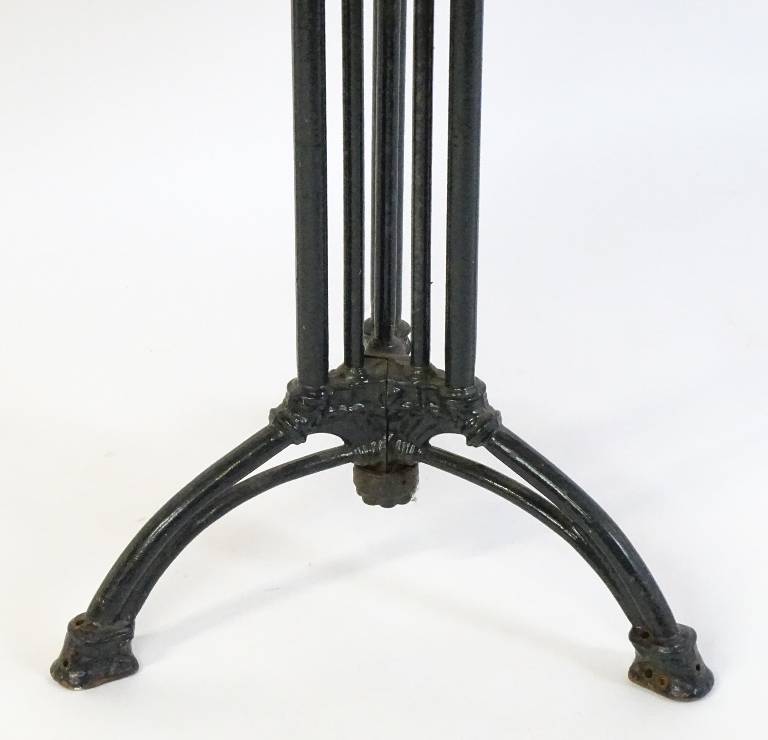 An early 20thC cast iron based pub / cafe / bistro table, with squared advertising top marked - Image 4 of 12