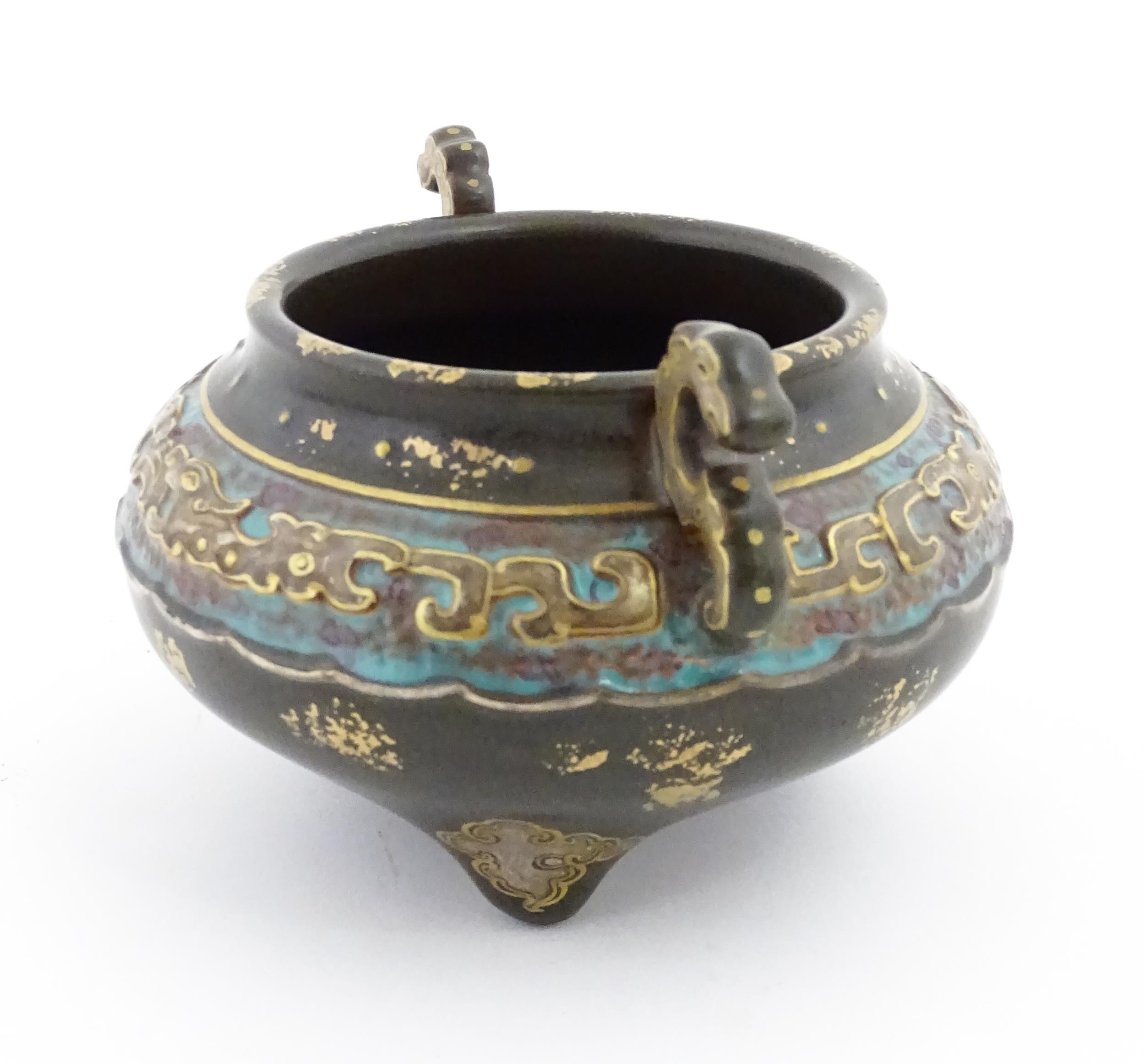 A small Chinese censer with twin handles with banded decoration in relief depicting stylised dragons - Image 5 of 8