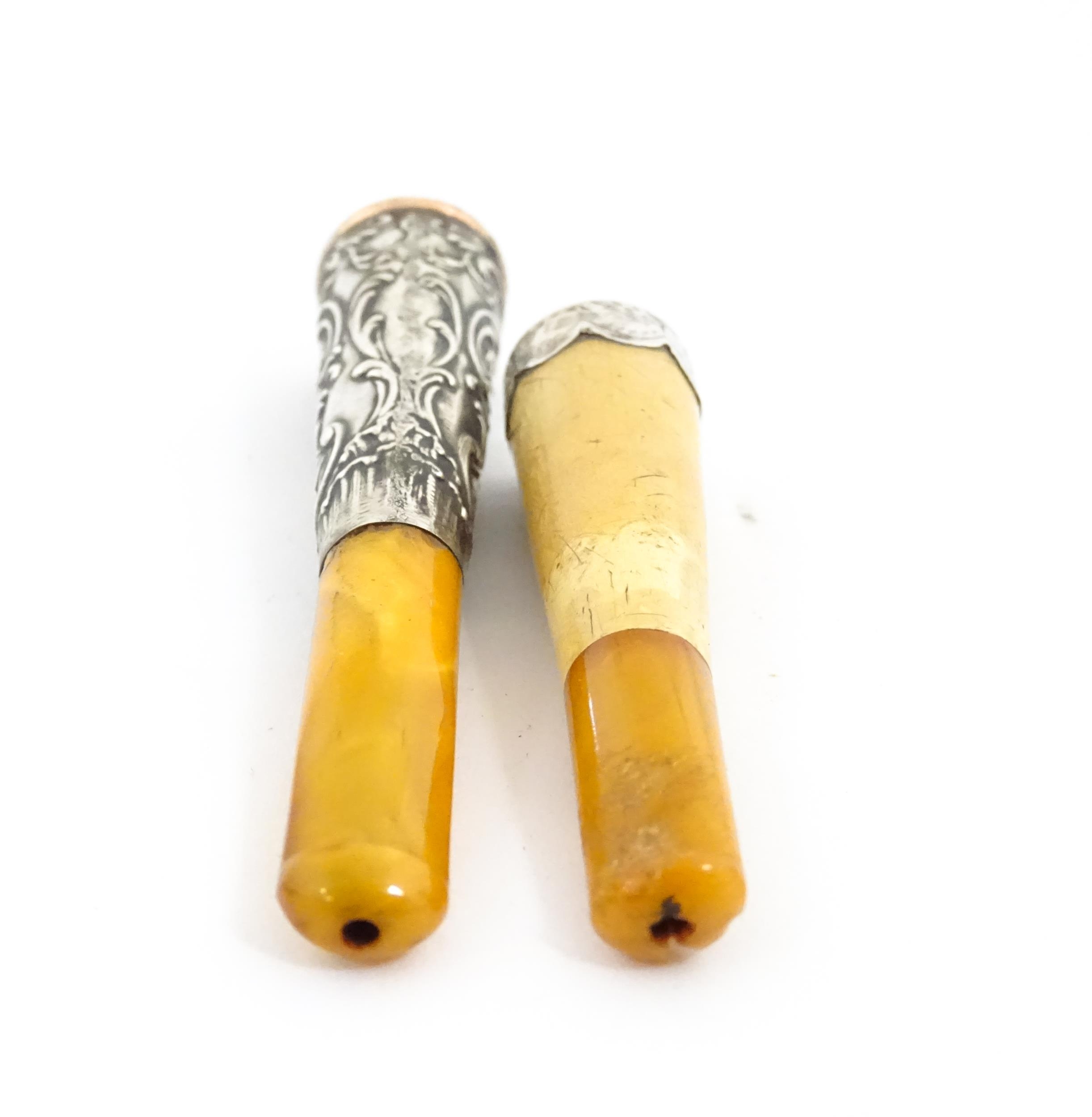 Two amber cheroot mouthpiece holders with white metal mounts, one with meerschaum detail. On - Image 8 of 8