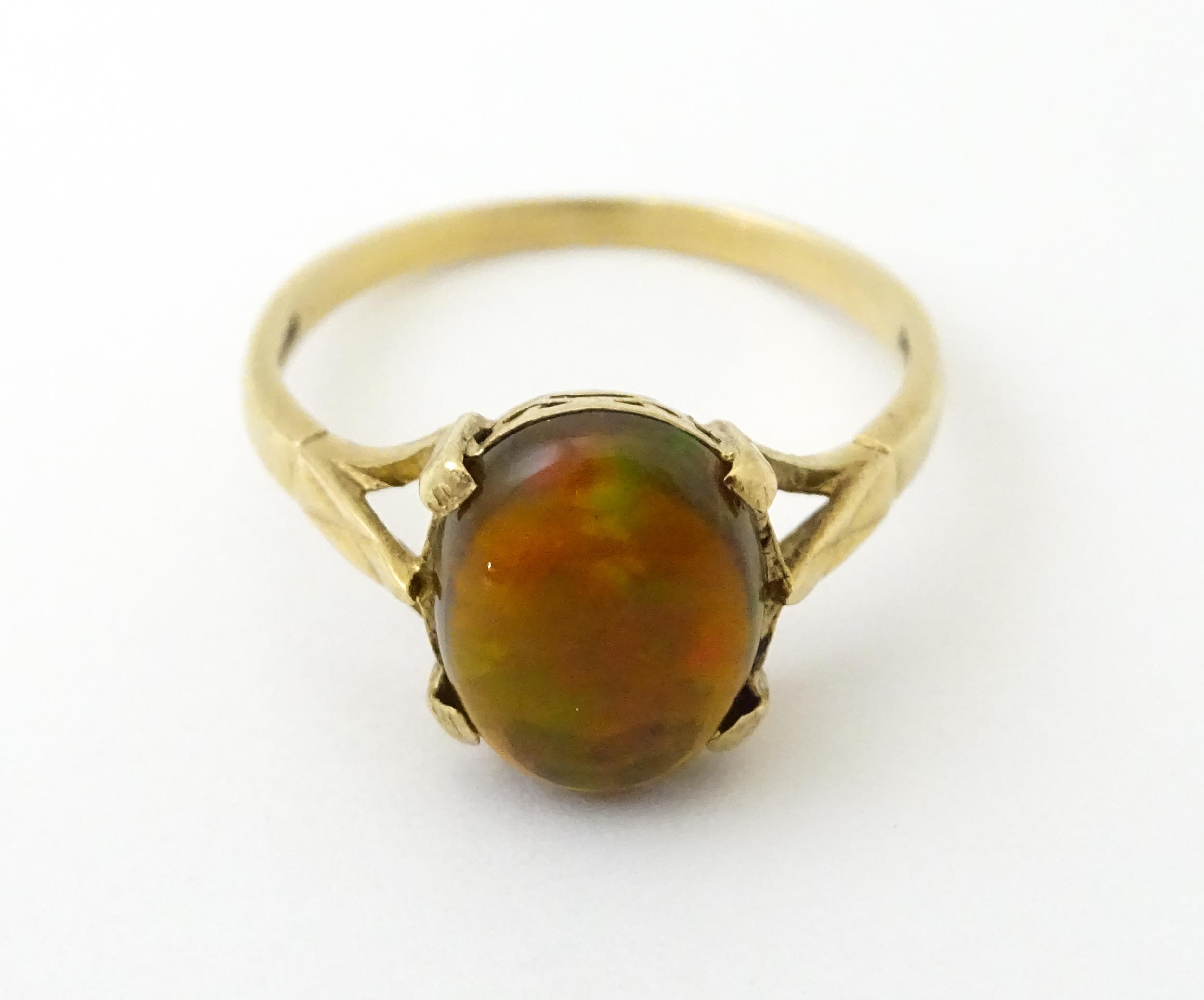 A 9ct gold ring set with fire opal cabochon. Ring size approx. R. Please Note - we do not make - Image 3 of 7