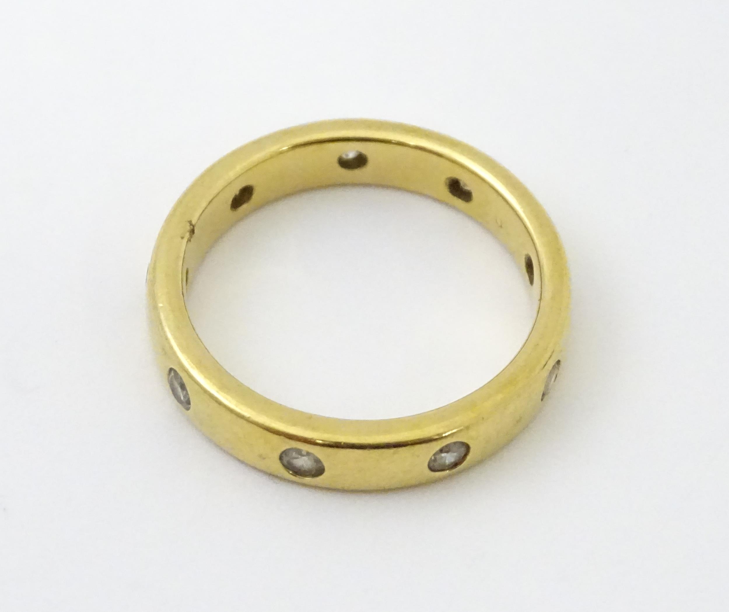 A yellow metal eternity ring set with white stones. Ring size approx. Q 1/2 Please Note - we do - Image 4 of 6