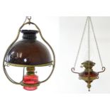 A Hinks & Son hanging pendant oil lamp. Together with another. Largest approx. 18" high (2) Please