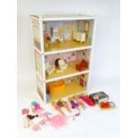 Toys: A 20thC Sindy three storey dolls house with open front, with Sindy furniture to include