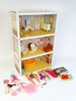 Toys: A 20thC Sindy three storey dolls house with open front, with Sindy furniture to include