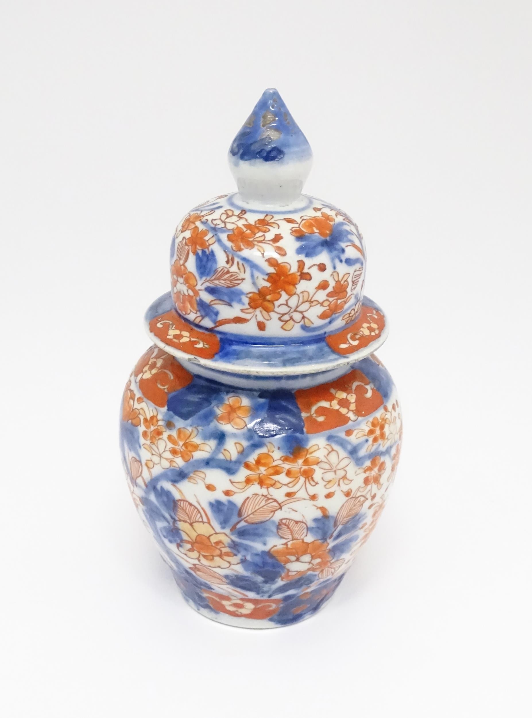 An Oriental ginger jar decorated in the Imari palette with flowers and foliage. Approx. 7 1/2" - Image 4 of 7