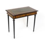 A 19thC side table with a satinwood inlaid top enclosing a gold tooled green leather top above a