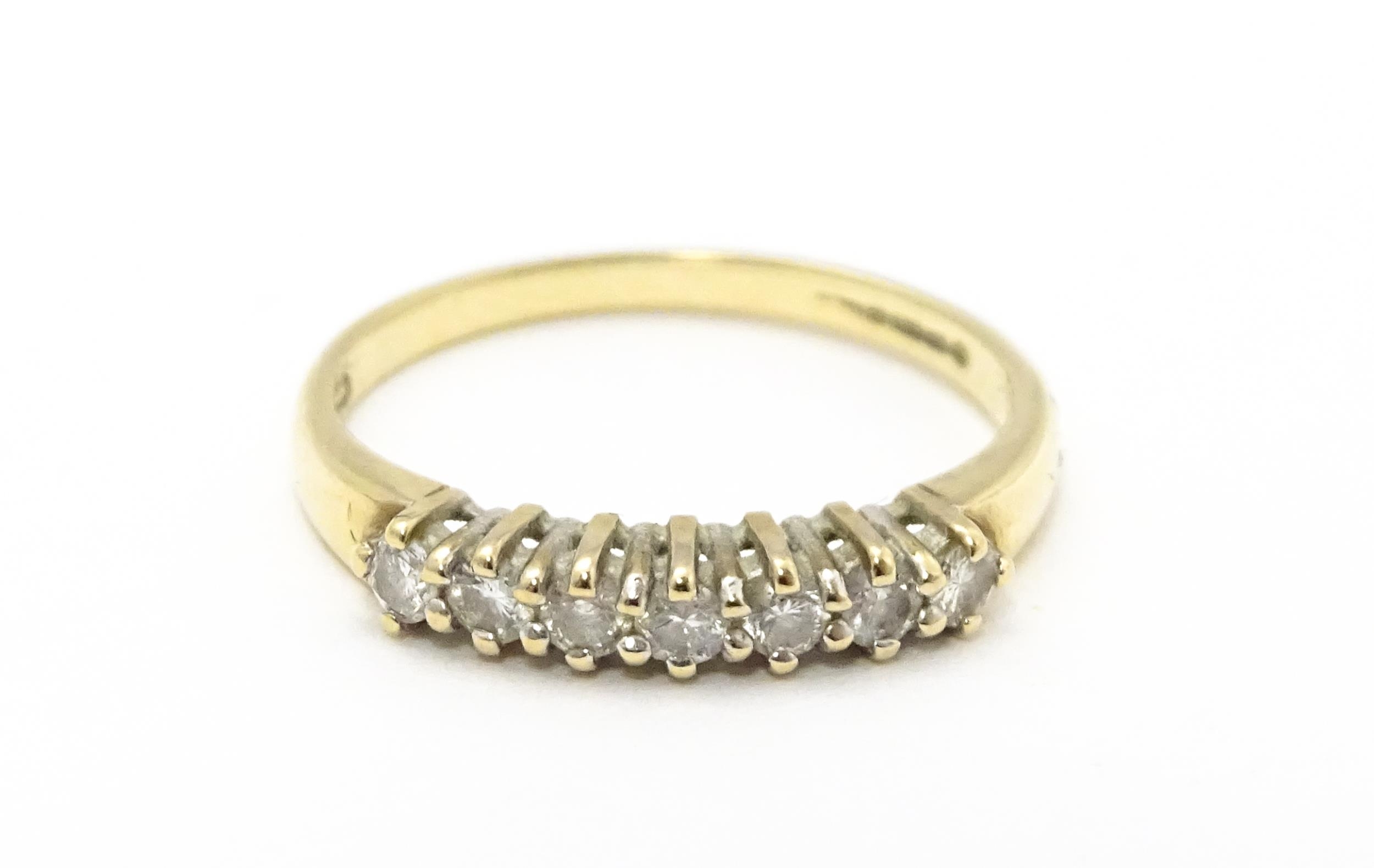 A 9ct gold ring set with seven diamonds in a linear setting. Ring size approx. K 1/2 Please Note - - Image 3 of 7