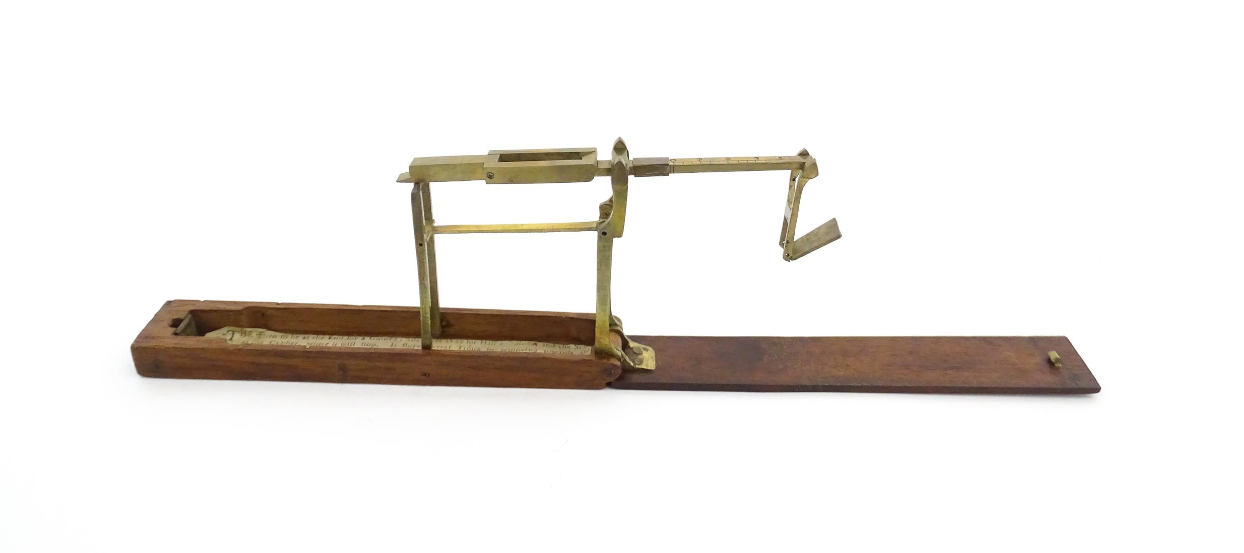 A 19thC mahogany cased brass folding guinea / coin scale. Case approx. 5 1/2" long Please Note - - Image 9 of 11