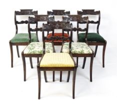 A set of six early / mid 19thC Irish dining chairs with floral and scroll carved mid and top rails