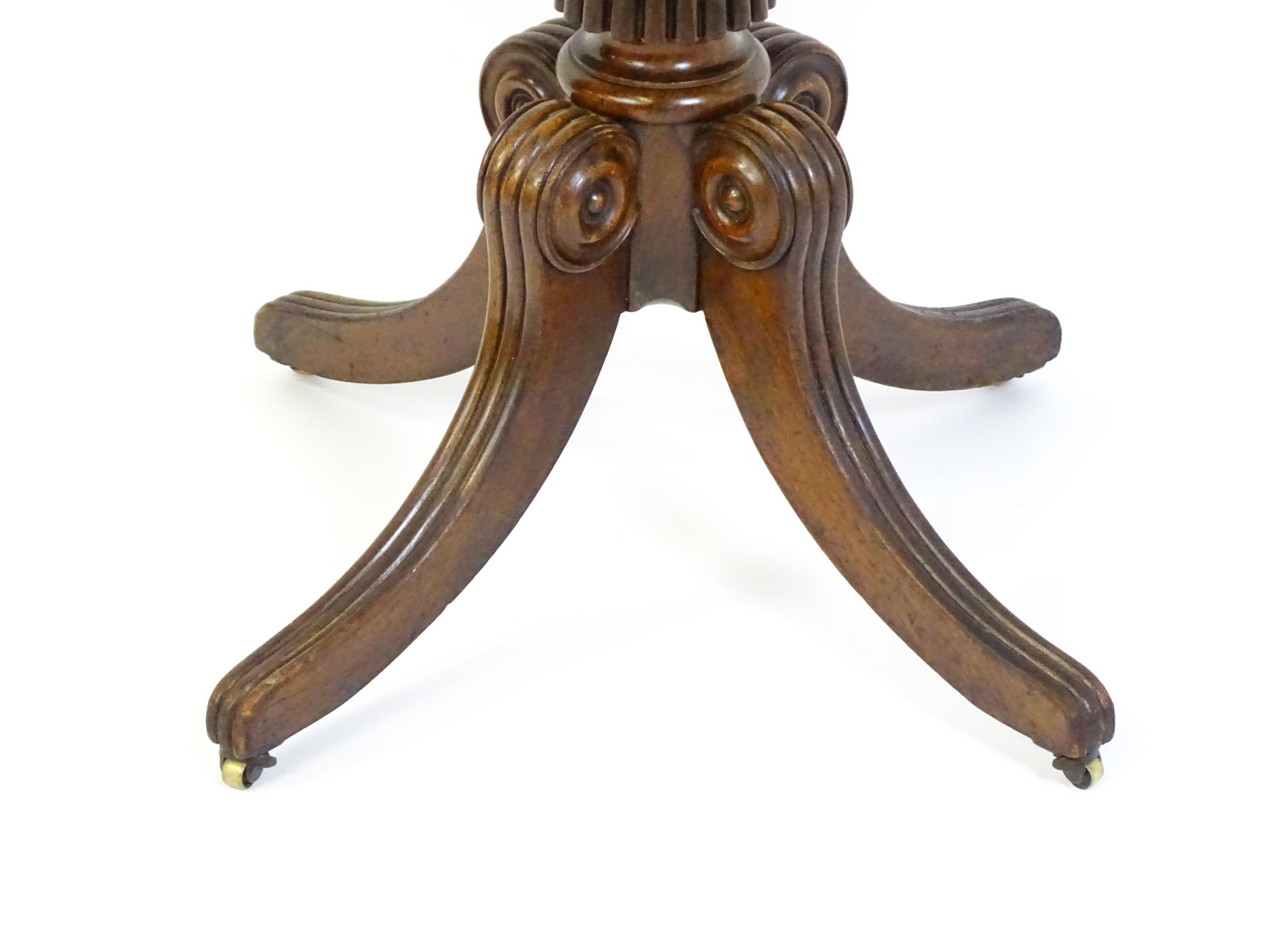 A 19thC mahogany occasional table, with a reeded tapering pedestal and raised on four reeded legs - Image 5 of 8