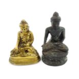 A cast model of a seated Buddha. Together with another. Largest approx. 5 1/4" high (2) Please