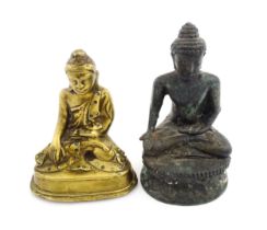 A cast model of a seated Buddha. Together with another. Largest approx. 5 1/4" high (2) Please