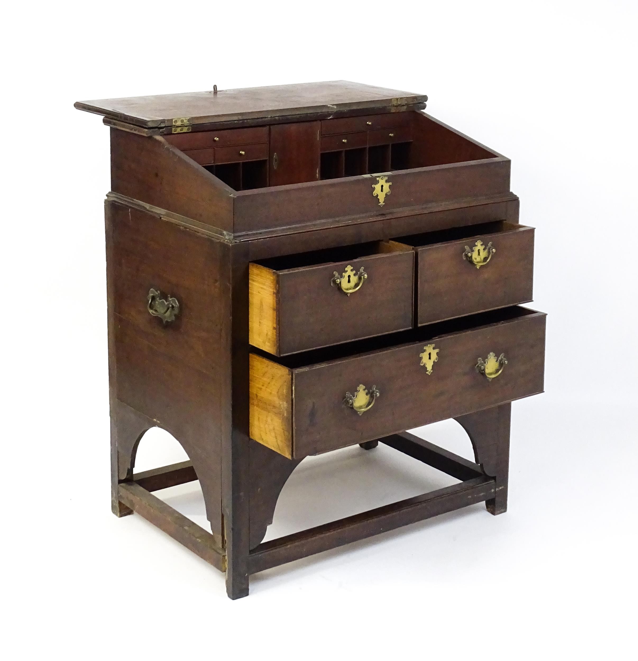 An early / mid 18thC mahogany clerks desk with a hinged sloping lid opening to show a fitted - Image 3 of 8