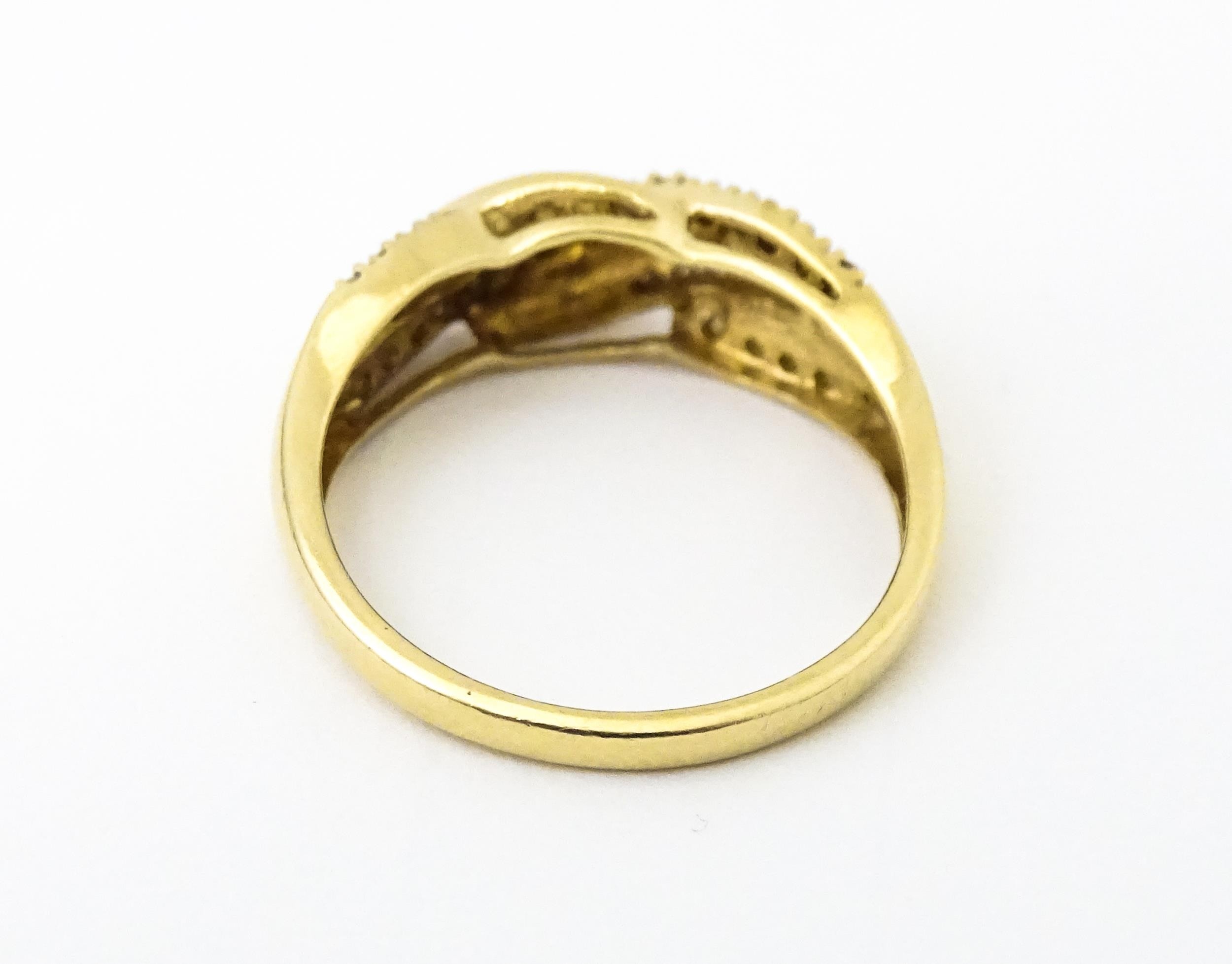 A 14ct gold with twist detail set with diamonds. Ring size approx. Q 1/2 Please Note - we do not - Image 6 of 7