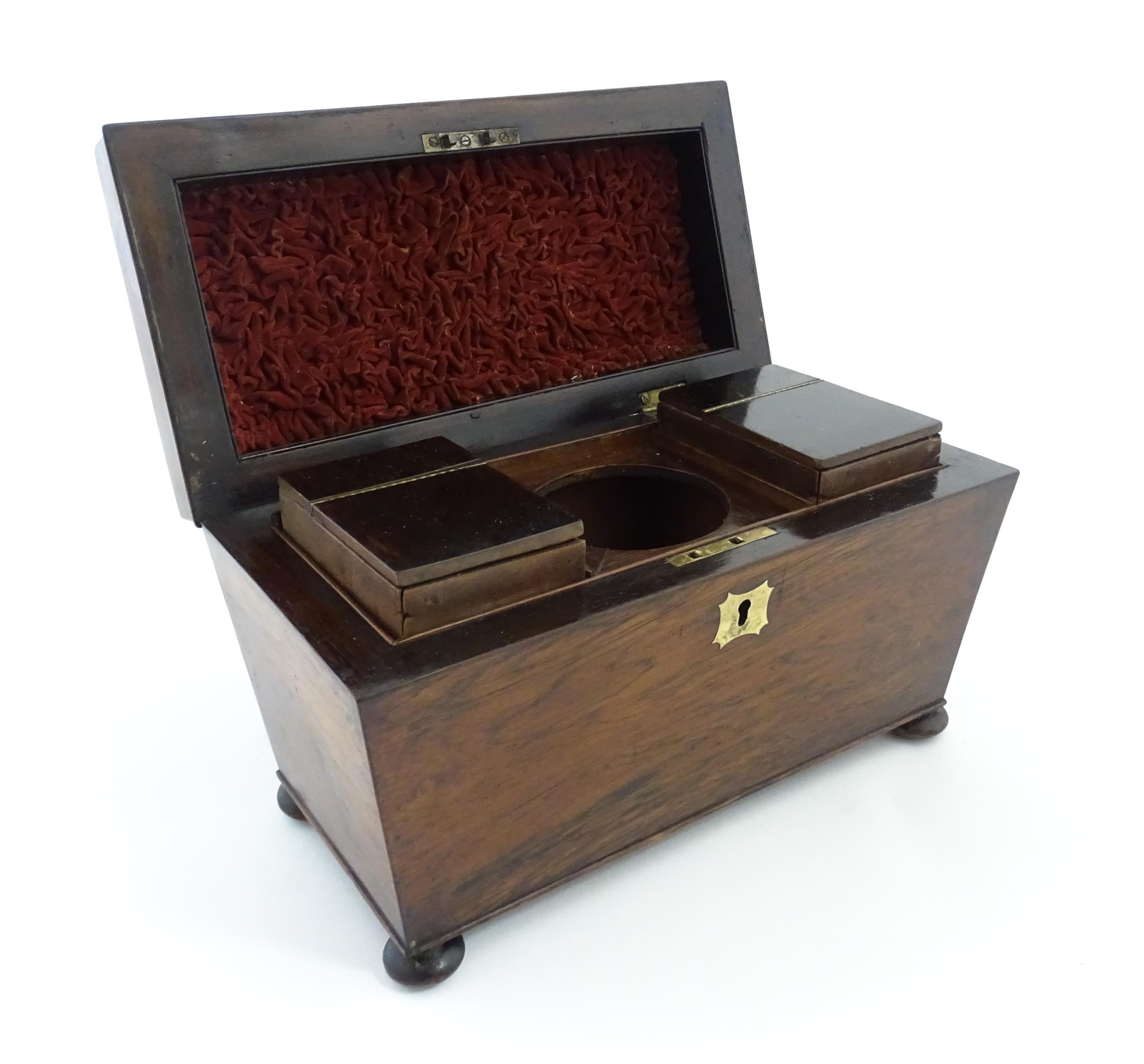 A 19thC rosewood tea caddy of sarcophagus form with four squat bun feet. The interior with two - Image 8 of 15