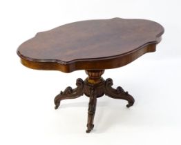 A 19thC mahogany centre table with a moulded top having two frieze drawers, the pedestal having