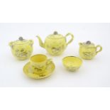 A quantity of Leeds Pottery tea wares with a yellow ground decorated in silver lustre with foliage