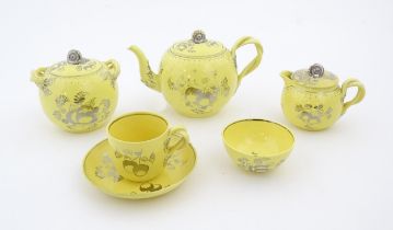 A quantity of Leeds Pottery tea wares with a yellow ground decorated in silver lustre with foliage