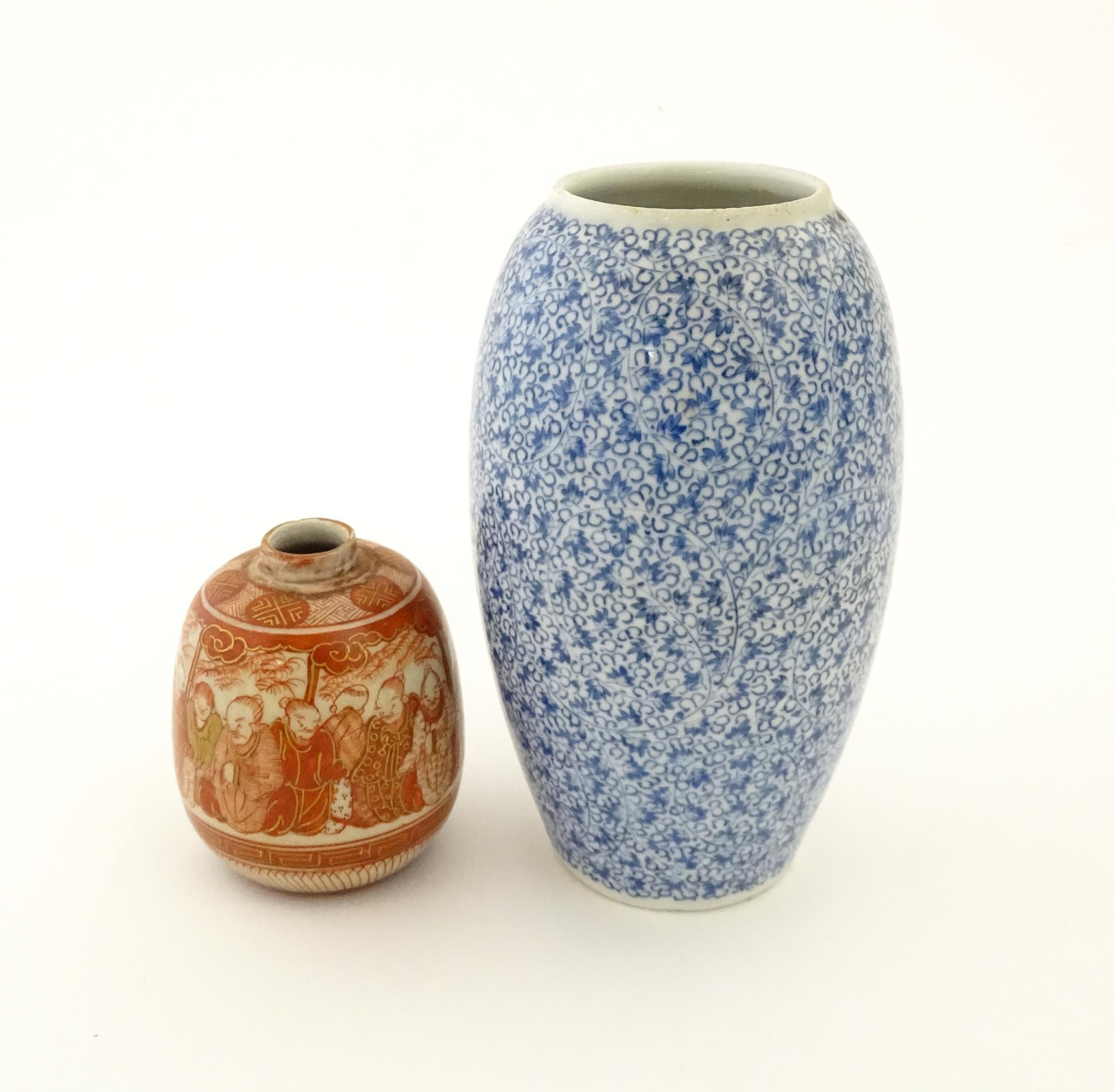 An Oriental blue and white vase of ovoid form decorated with scrolling foliage. Together with a