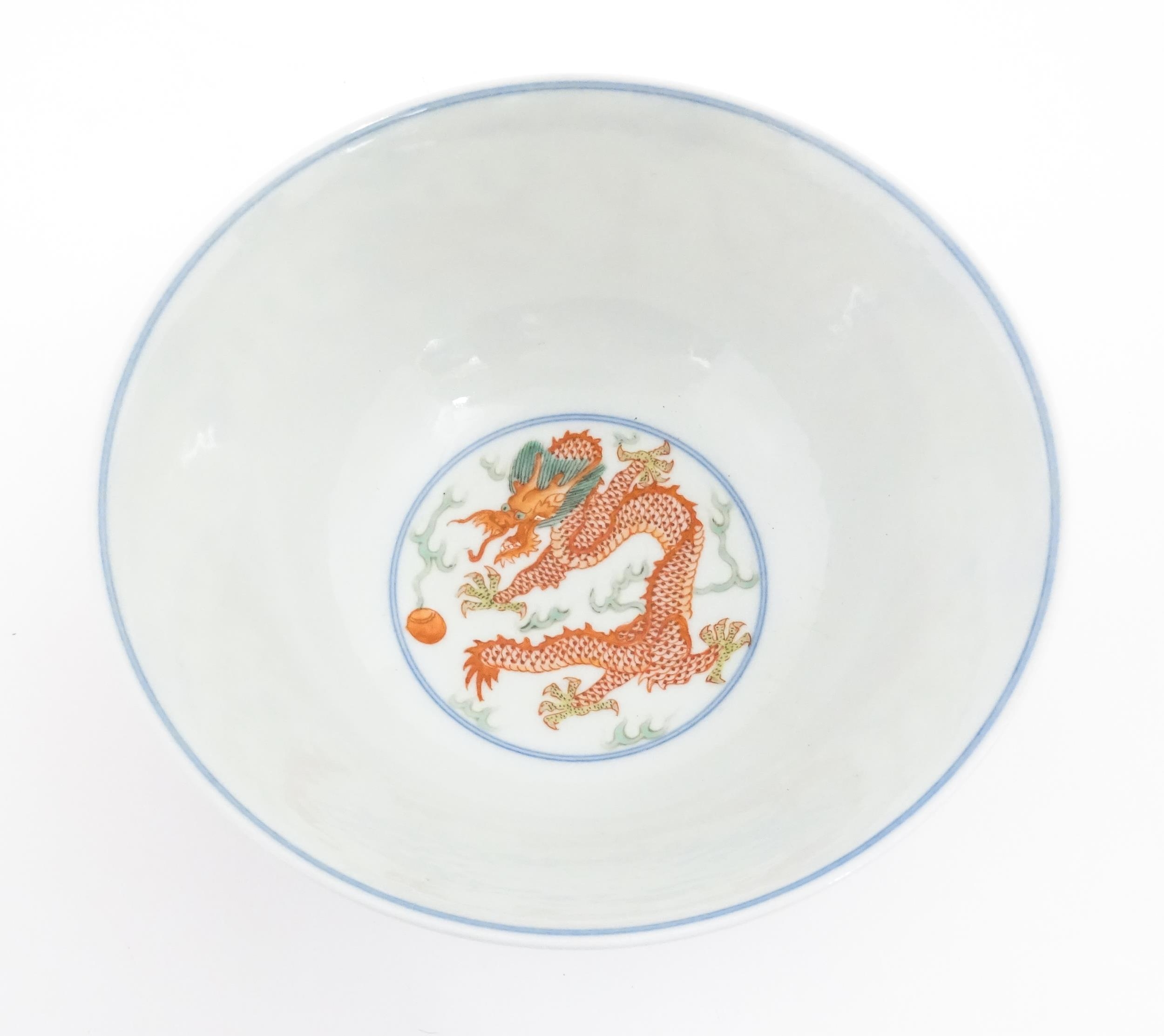 A Chinese bowl decorated with dragons, phoenix birds, flaming pearls and flowers. Character marks - Image 7 of 9