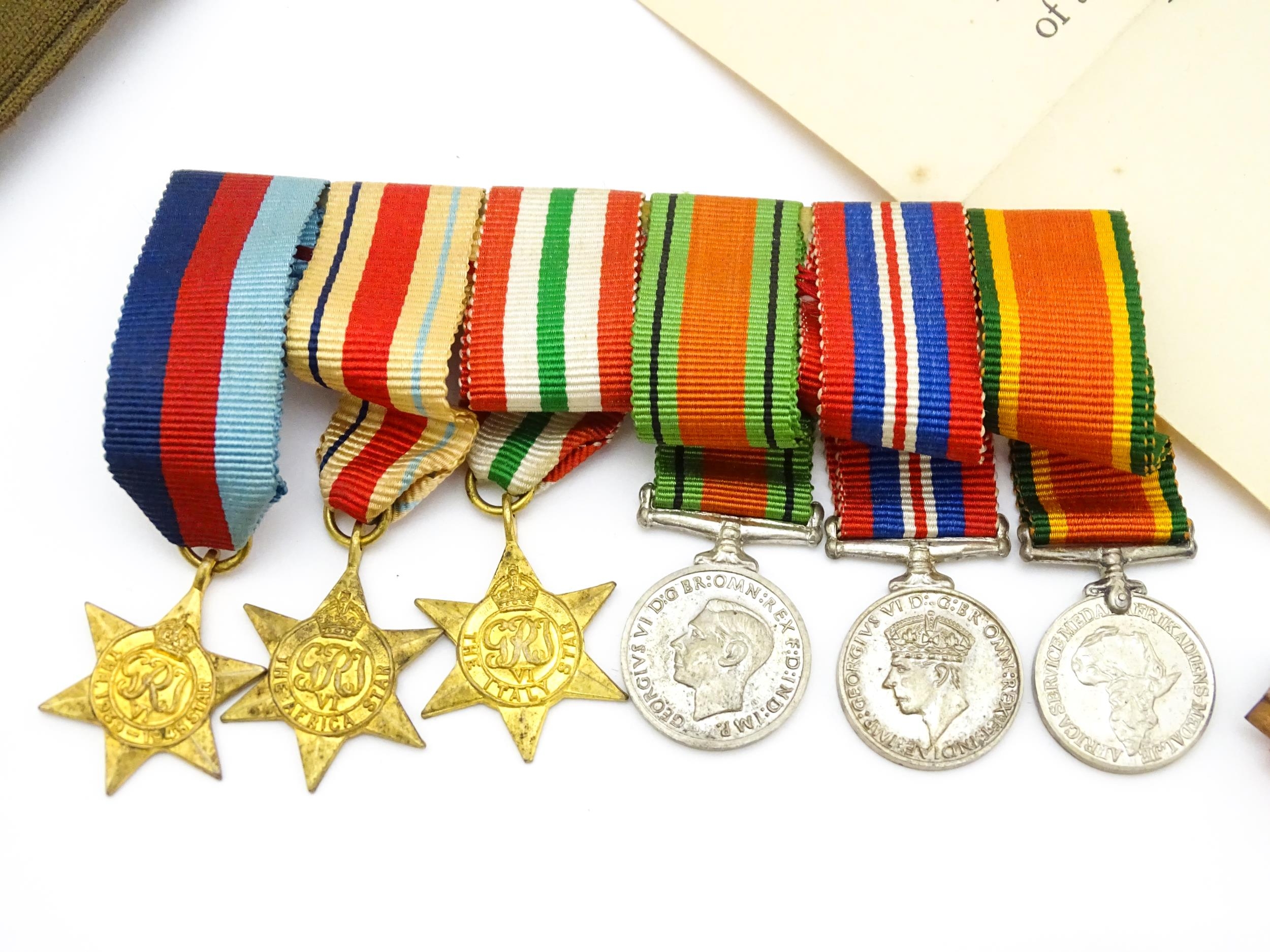 Militaria : a quantity of 20thC medals and insignia, comprising two WWI campaign medals to Gnr. W. - Image 9 of 16
