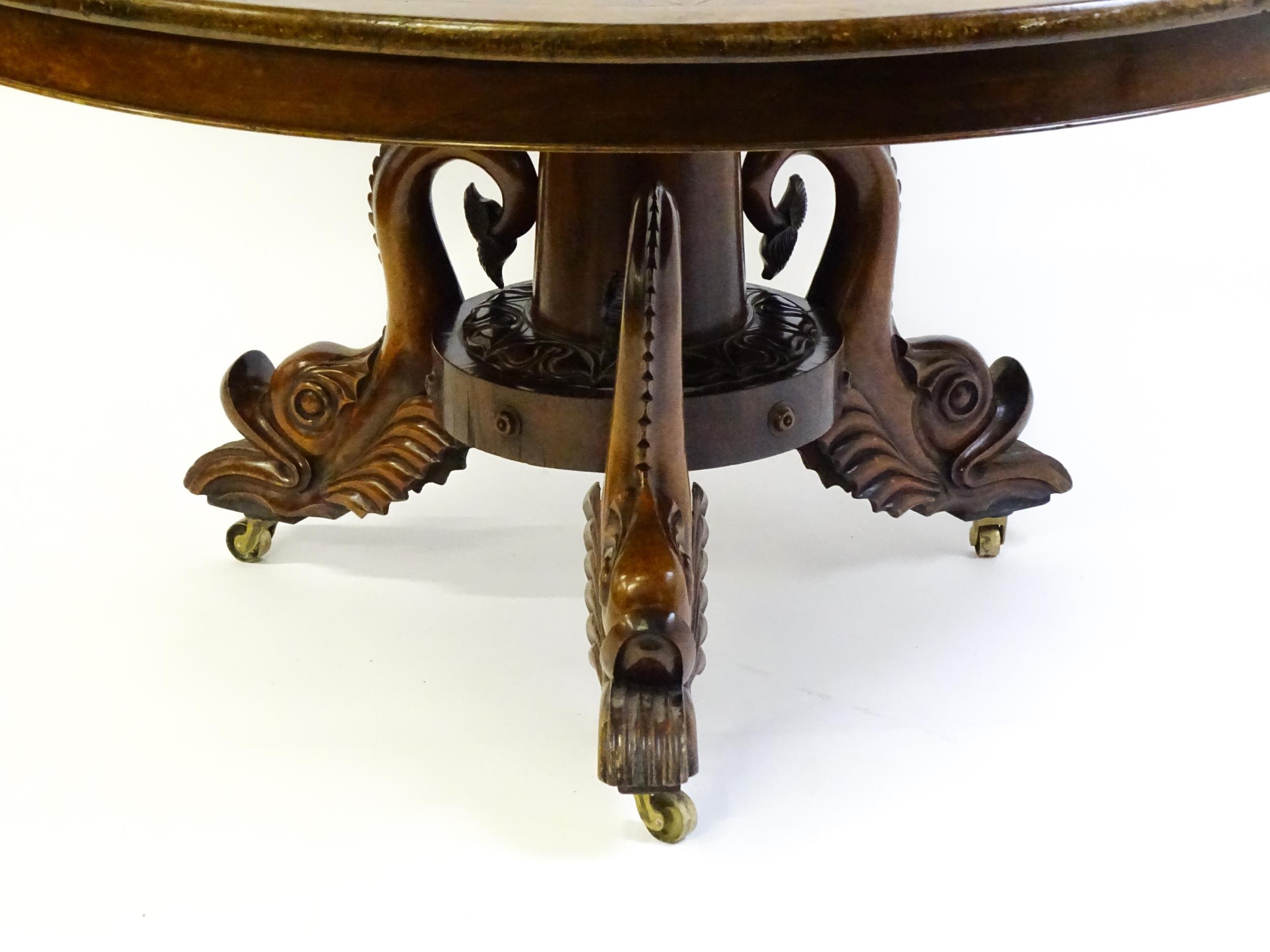 A 19thC dining table with an olive wood veneered circular top raised on a rosewood pedestal with - Image 13 of 15