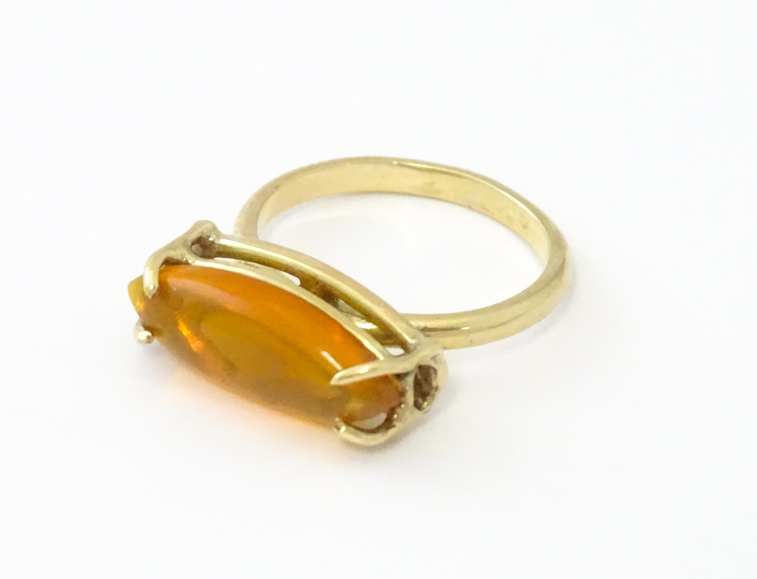 A 9ct gold ring with fire opal approx 3/4" long. Ring size approx. M Please Note - we do not make - Image 3 of 7