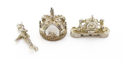 Three novelty pendant charms formed as a crown, solider and clock. The soldier approx 1 1/4" long (