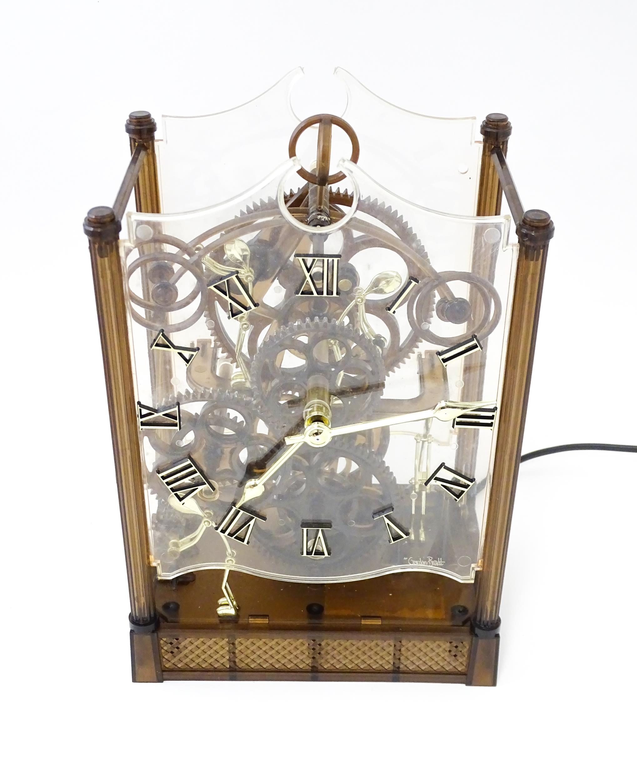 An Arrow Industries ' Electric Master Motion Clock' known as the Animated Time Machine' of plastic