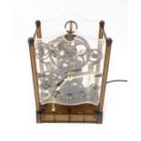 An Arrow Industries ' Electric Master Motion Clock' known as the Animated Time Machine' of plastic