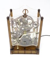An Arrow Industries ' Electric Master Motion Clock' known as the Animated Time Machine' of plastic