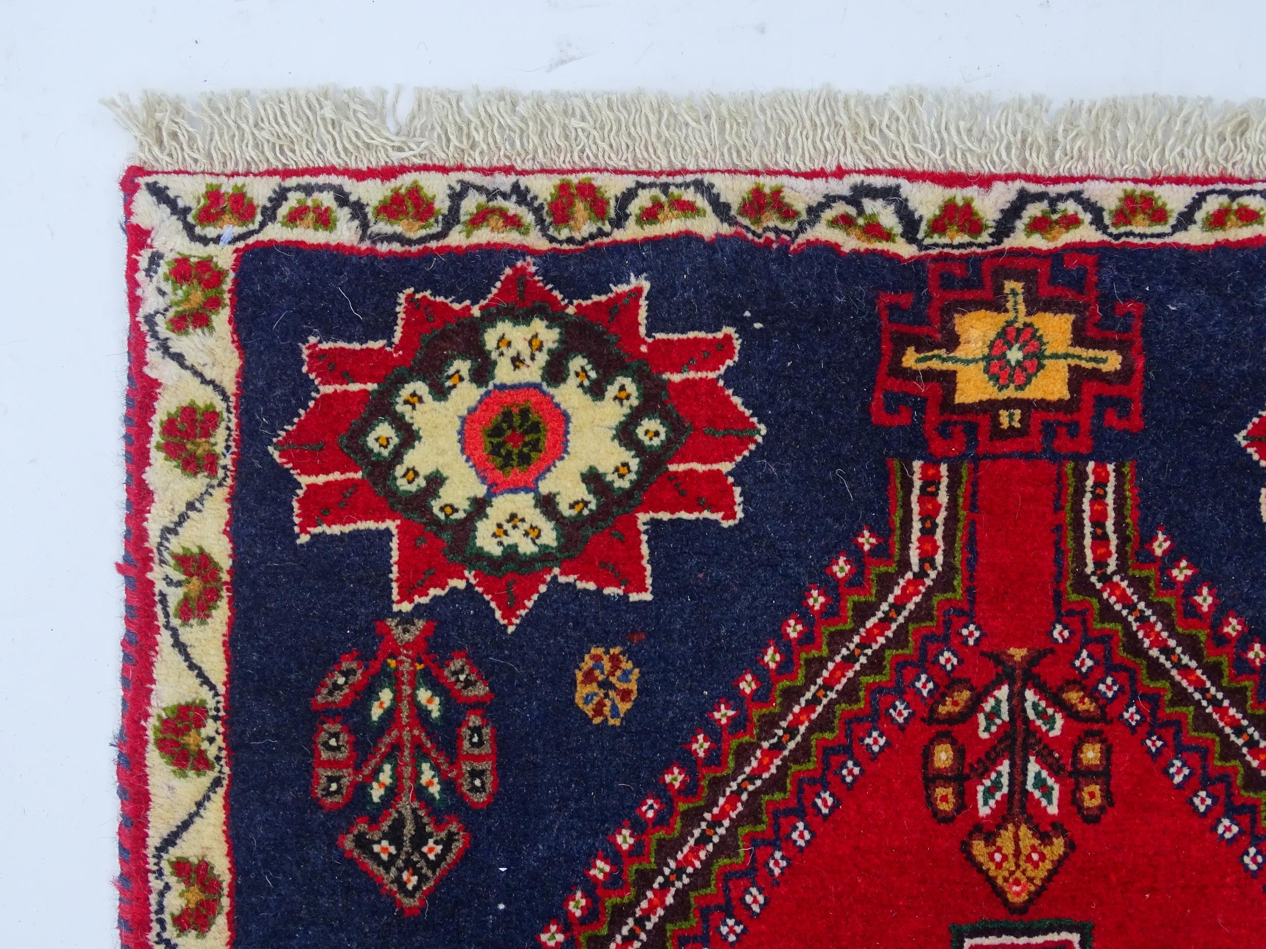 Carpet / Rug: A South West Persian qashgai runner, the red and blue ground with central geometric - Image 3 of 8