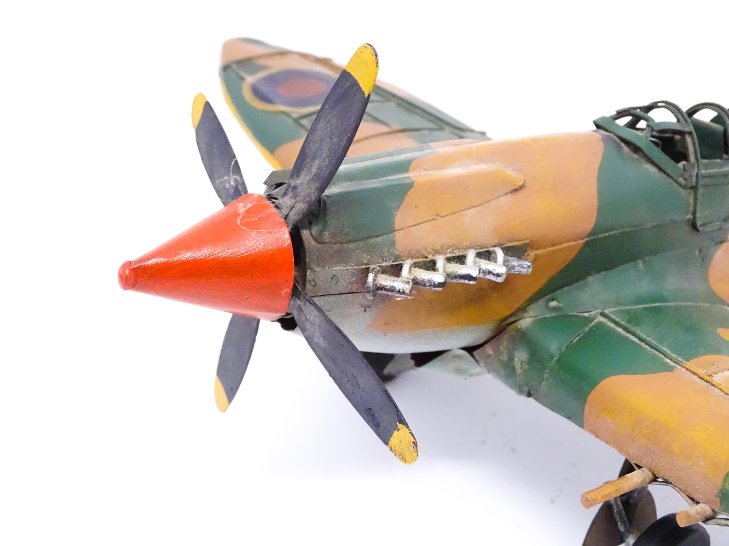 A 20thC scratch built tin plate scale model of a spitfire. Approx. 18" wide Please Note - we do - Image 5 of 10