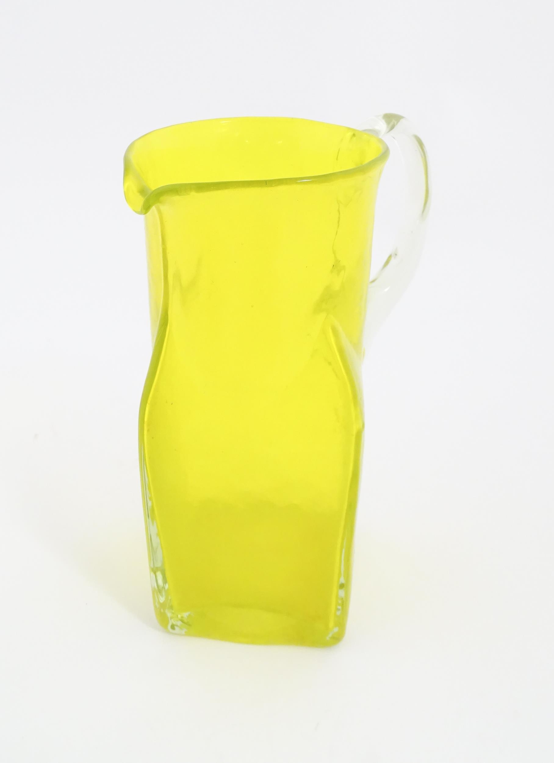 A 20thC yellow glass jug with squared base and clear glass handle. Approx. 8 1/2" high Please Note - - Image 3 of 11