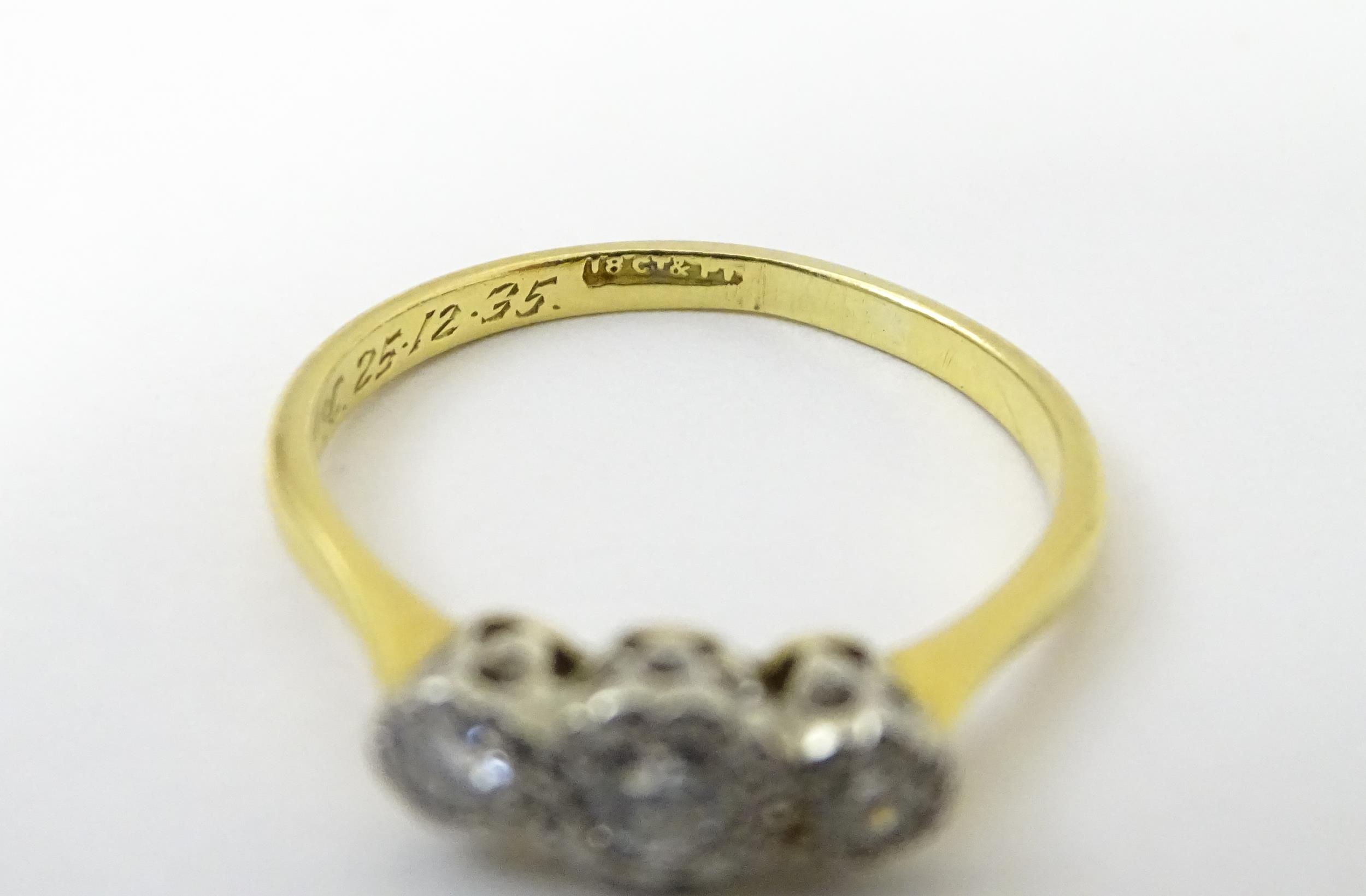 An 18ct gold ring with three platinum set diamonds. Ring size approx. O Please Note - we do not make - Image 15 of 18