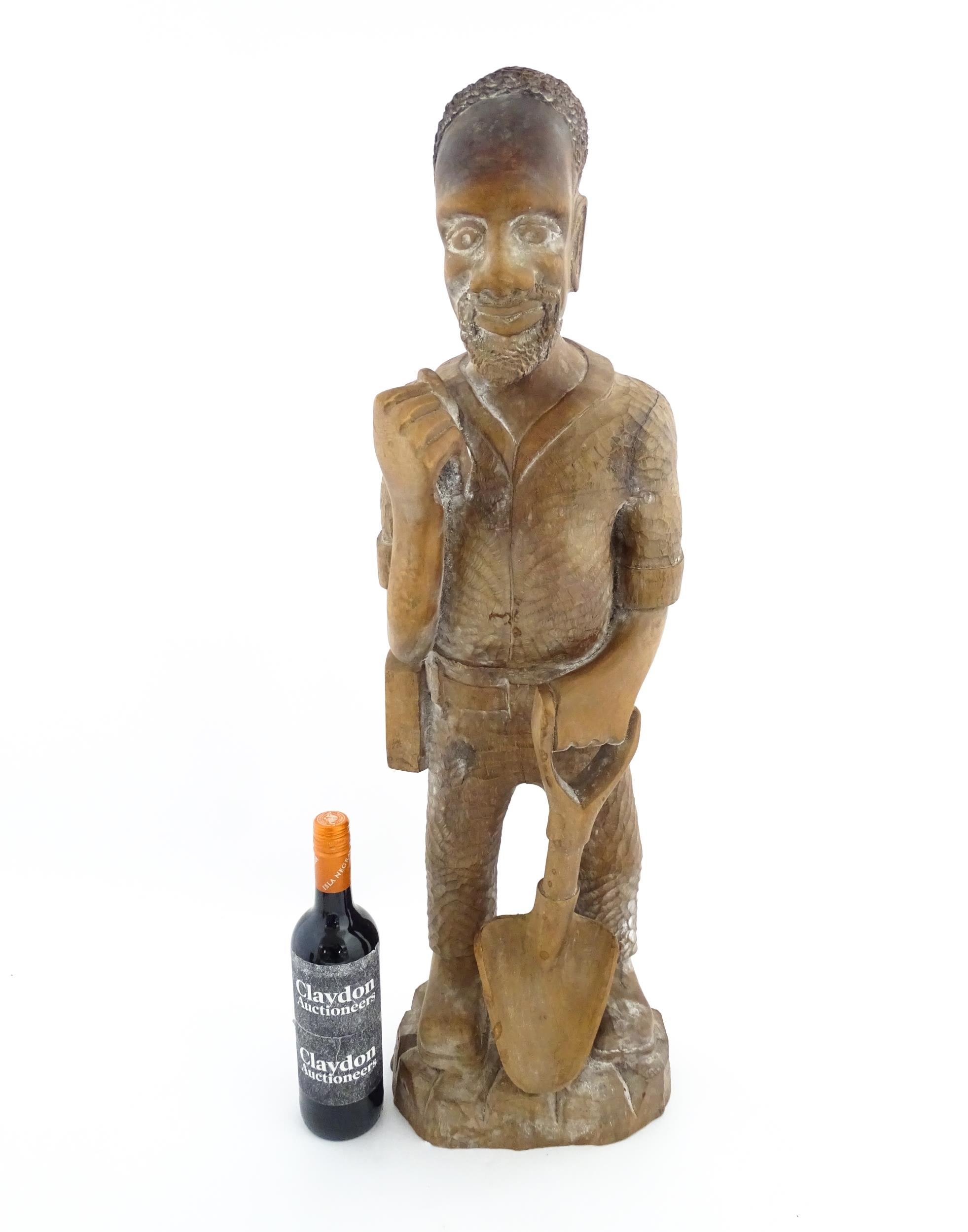 Ethnographic / Native / Tribal: An African carved wood figure modelled as a male farmer with a - Image 2 of 8