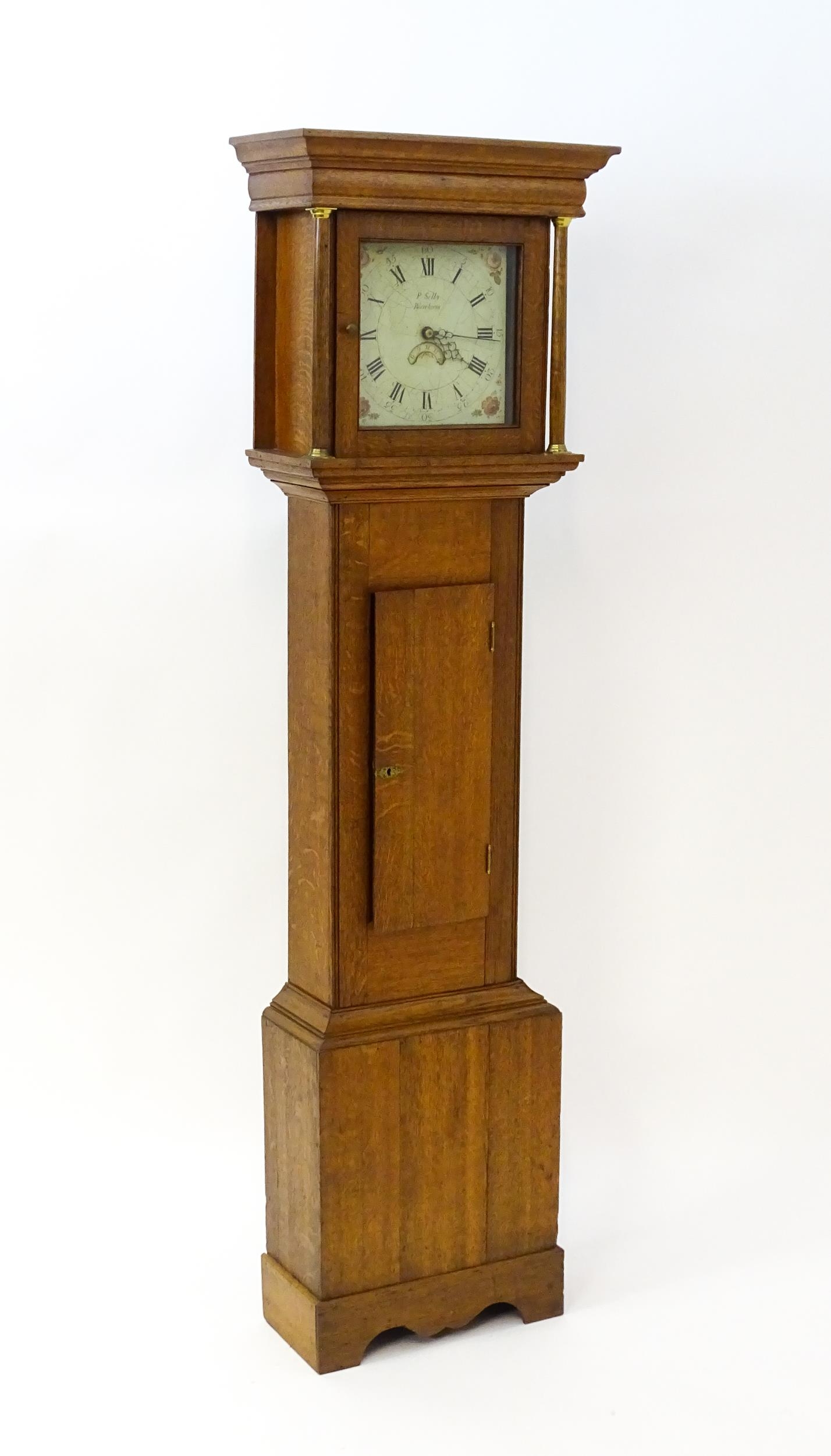 P Selby Wareham - Dorset : A late 18thC oak cased 30 hour longcase clock, the painted dial signed P.