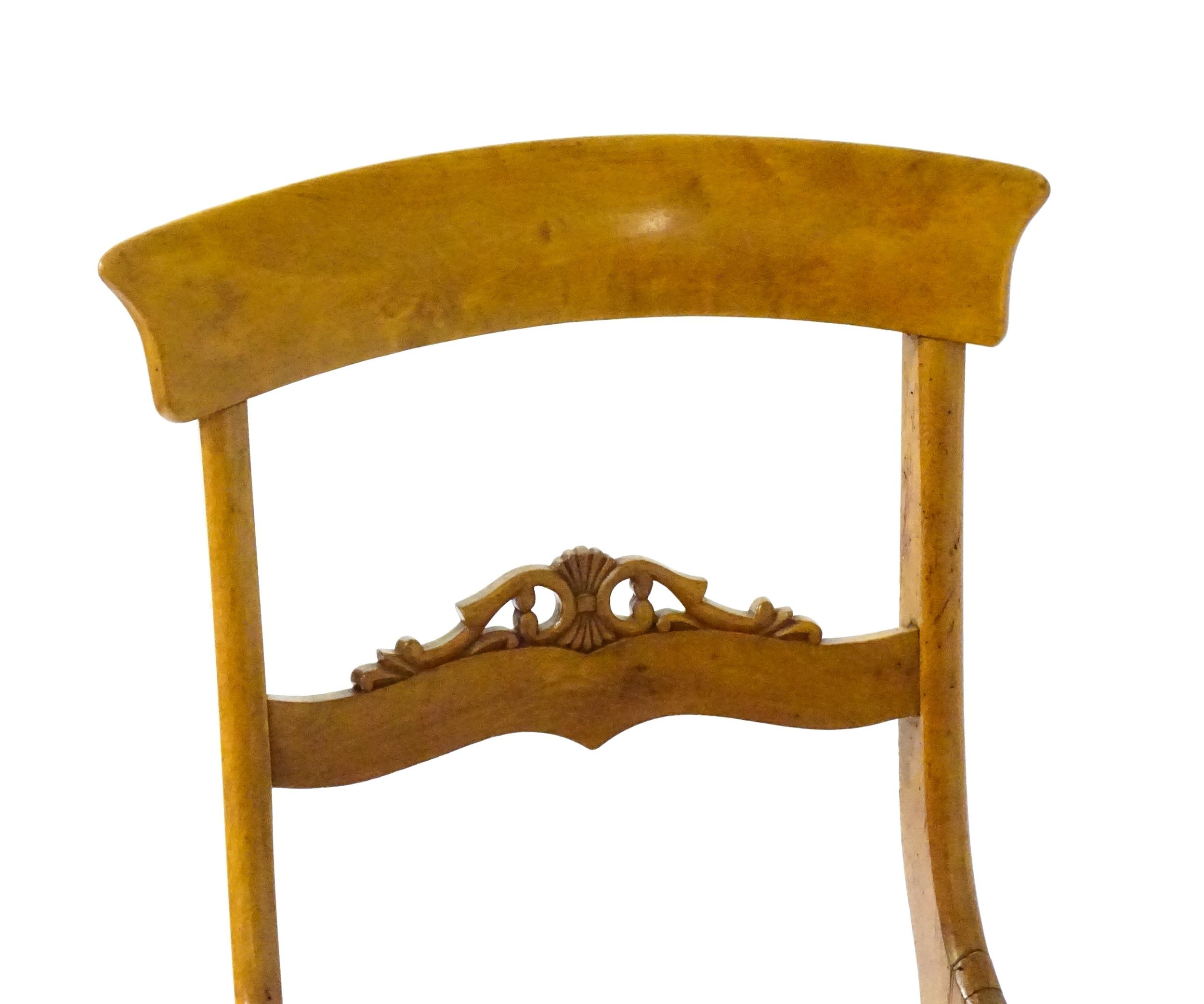 A pair of 19thC side chairs with bowed top rails, carved mid rails, drop in seats and raised on - Image 3 of 6