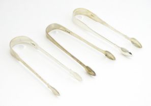 Three Georgian silver Fiddle and Old English pattern sugar tongs hallmarks to include London 1809,
