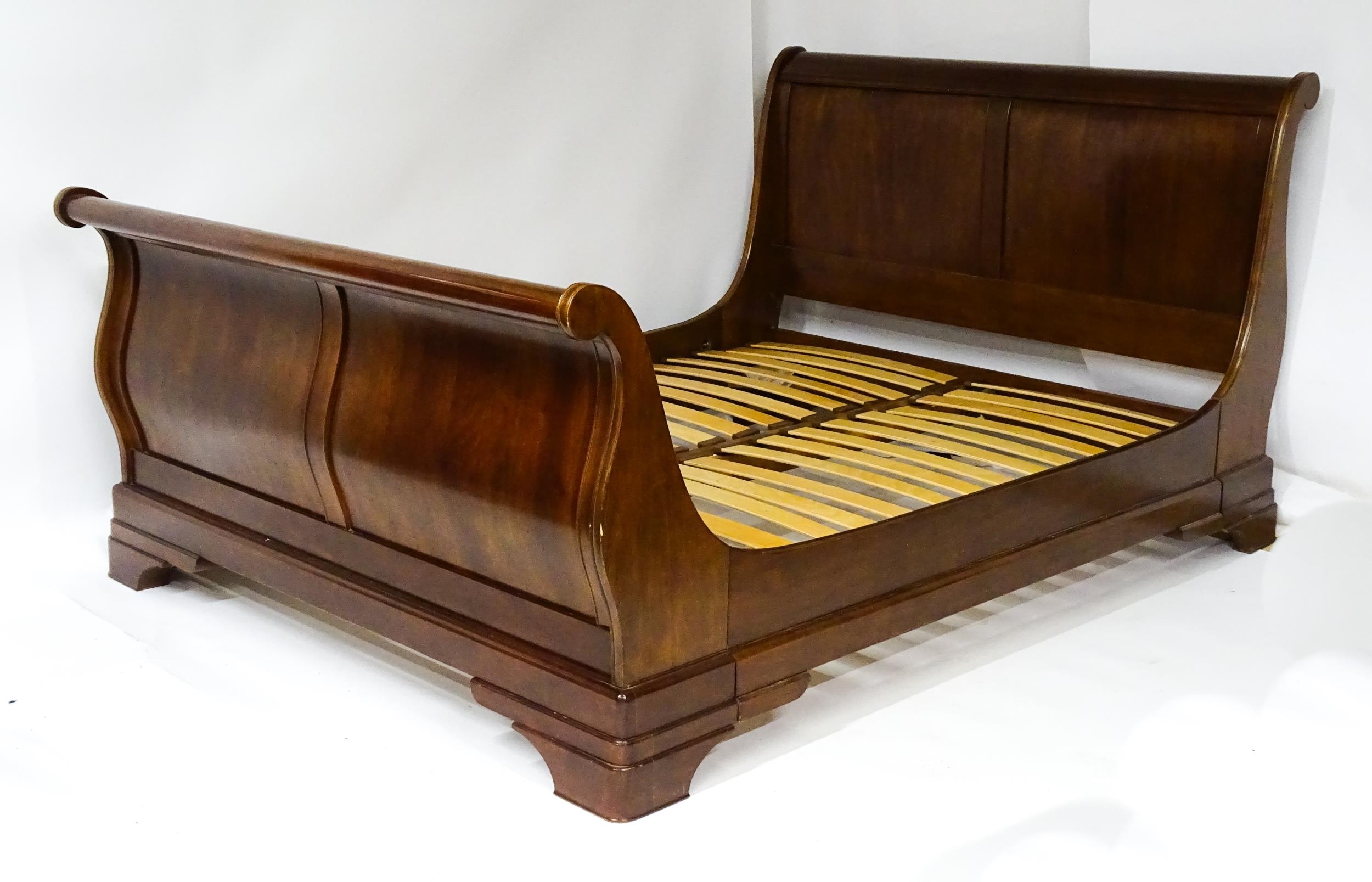 A modern mahogany sleigh bed. 6 1/2ft long x 5ft wide. Please Note - we do not make reference to the - Image 3 of 6