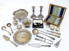 A quantity of silver plate to include servers, candlesticks, Art Deco strainer, asparagus servers,