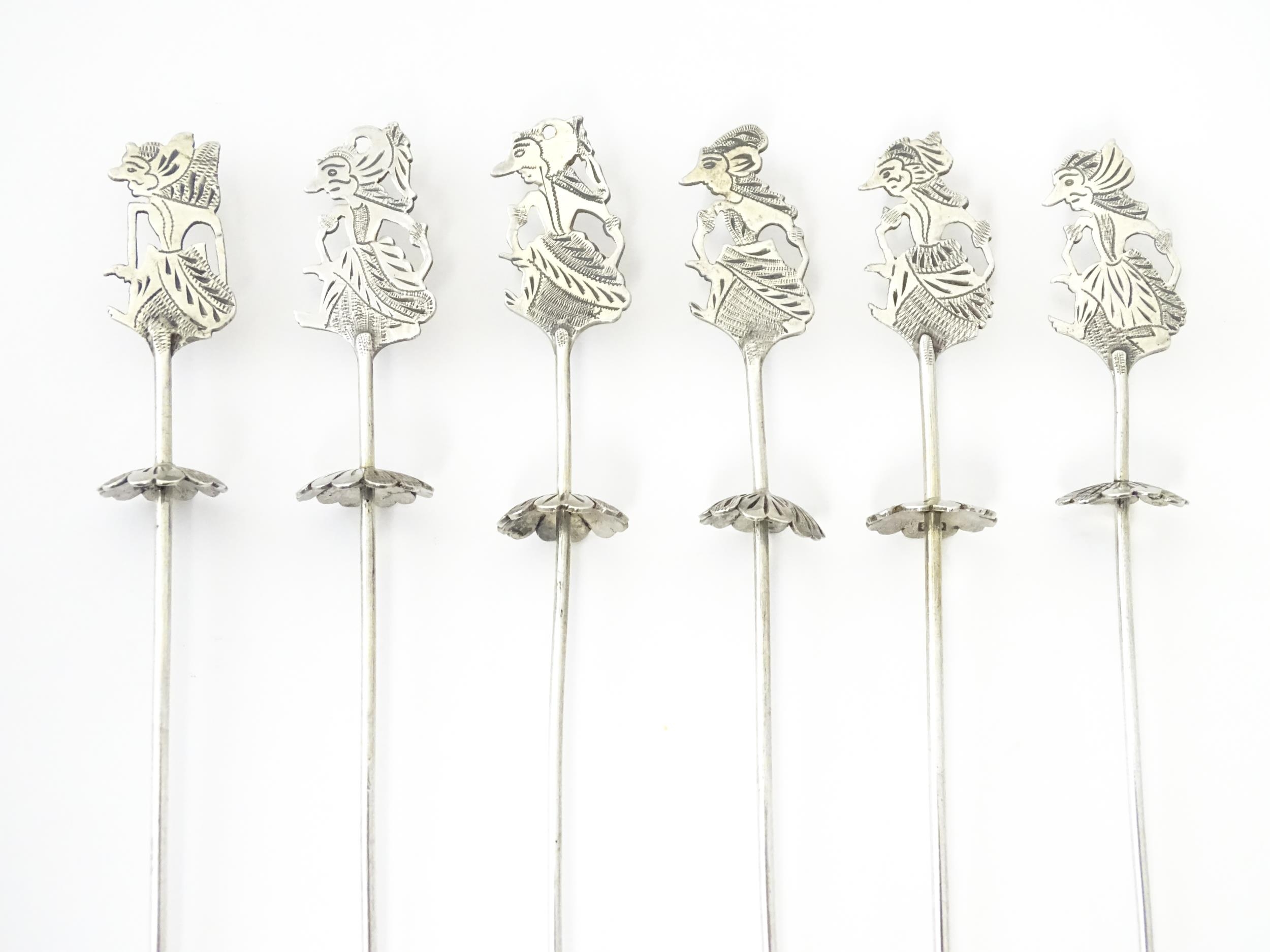 A set of Continental .800 silver skewers / long cocktail sticks with figural finials. Approx 7" long - Image 3 of 6