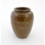 A stoneware vase / pot of tapering form with script detail. Approx. 6 1/4" high Please Note - we