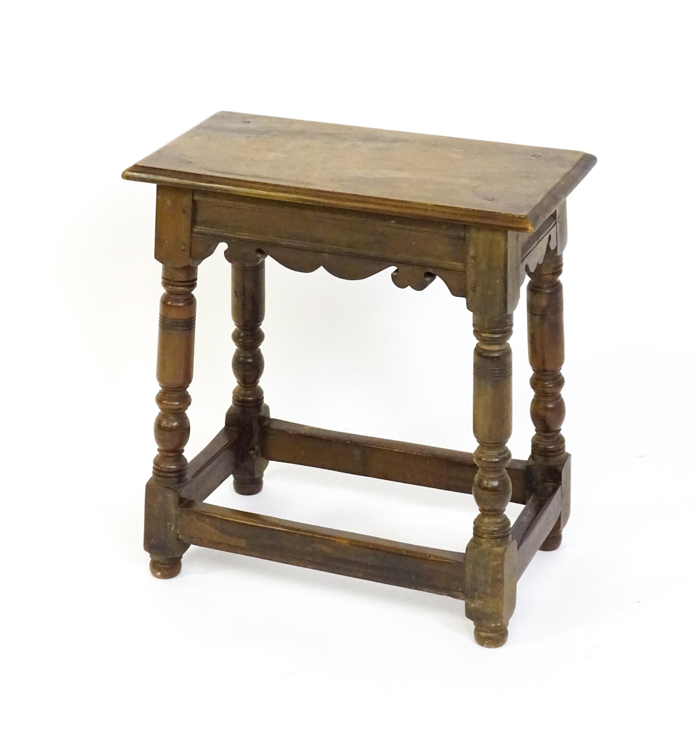 A 19thC walnut join stool of peg jointed construction, with a rectangular top above a moulded - Image 6 of 6