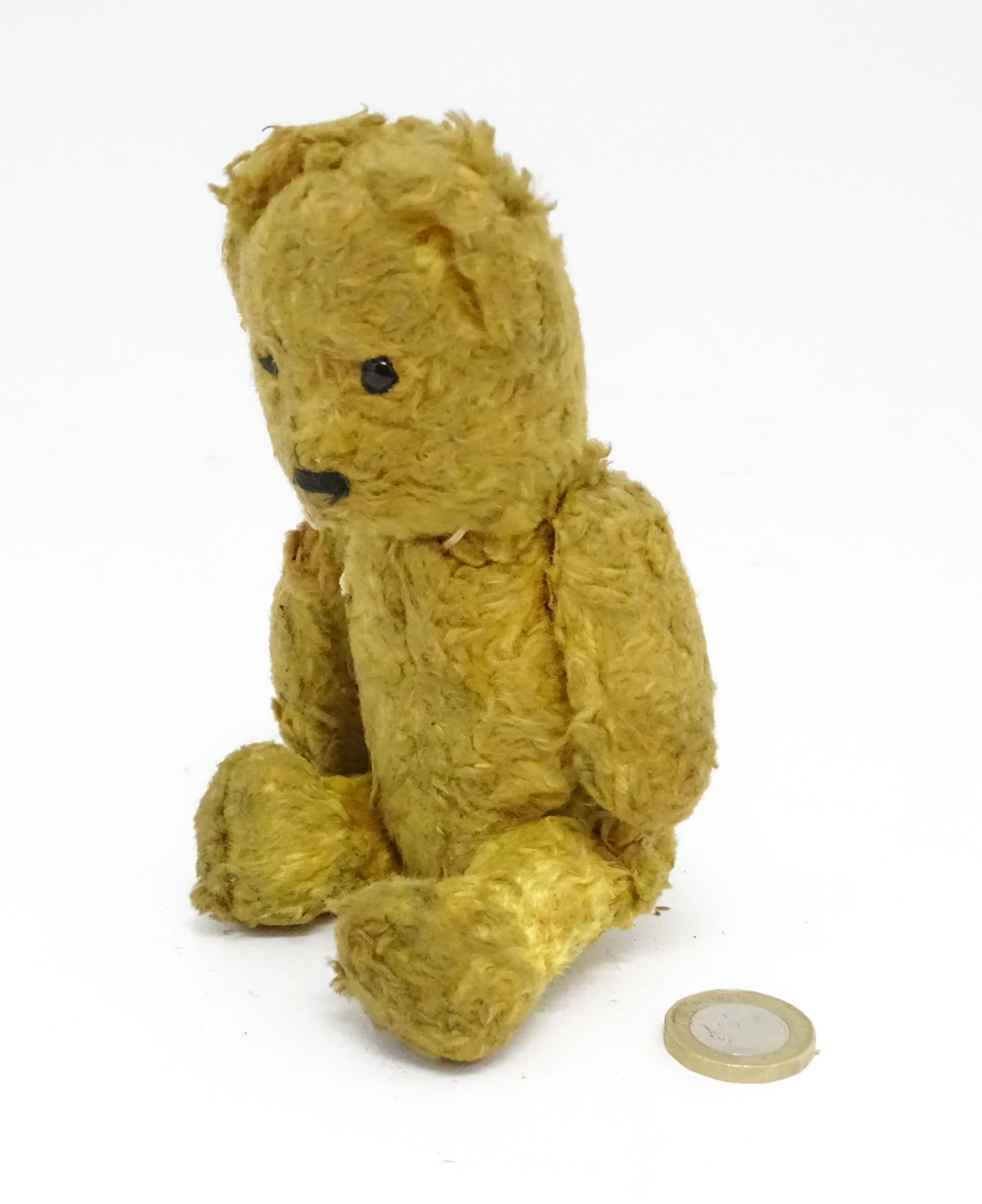 Toy: An early 20thC straw filled teddy bear with stitched nose and articulated limbs. Approx. 7" - Image 3 of 7