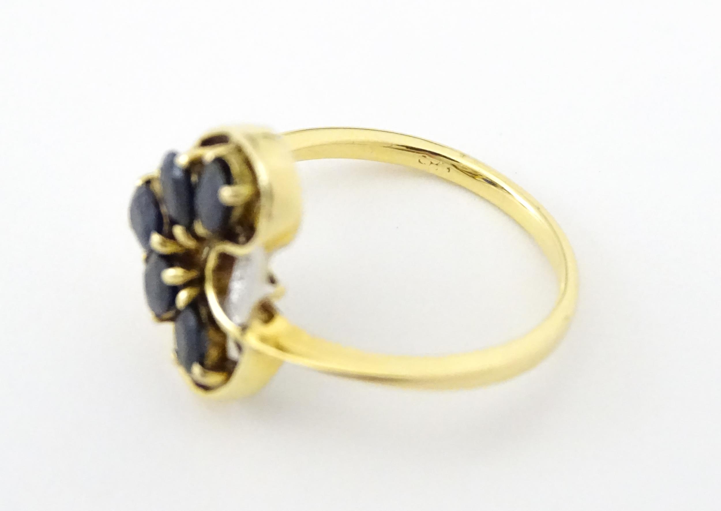 A 9ct gold ring set with 5 graduated blue spinel and two diamonds. Ring size approx. L 1/2 Please - Image 7 of 7